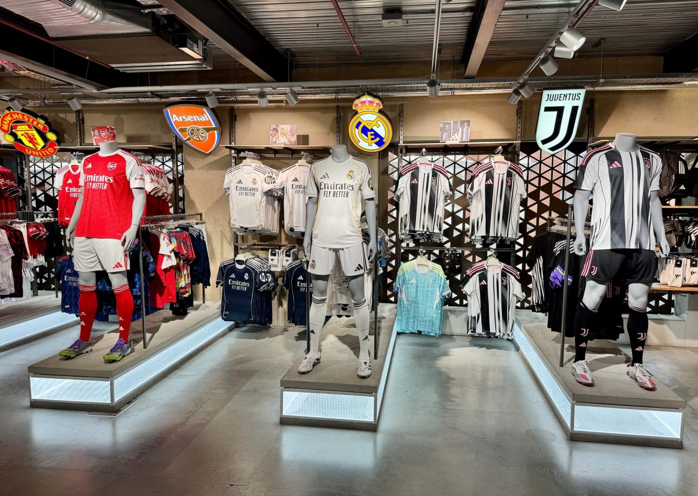 A picture from a shop, showing Juventus, Inter and AC Milan shirts on sale